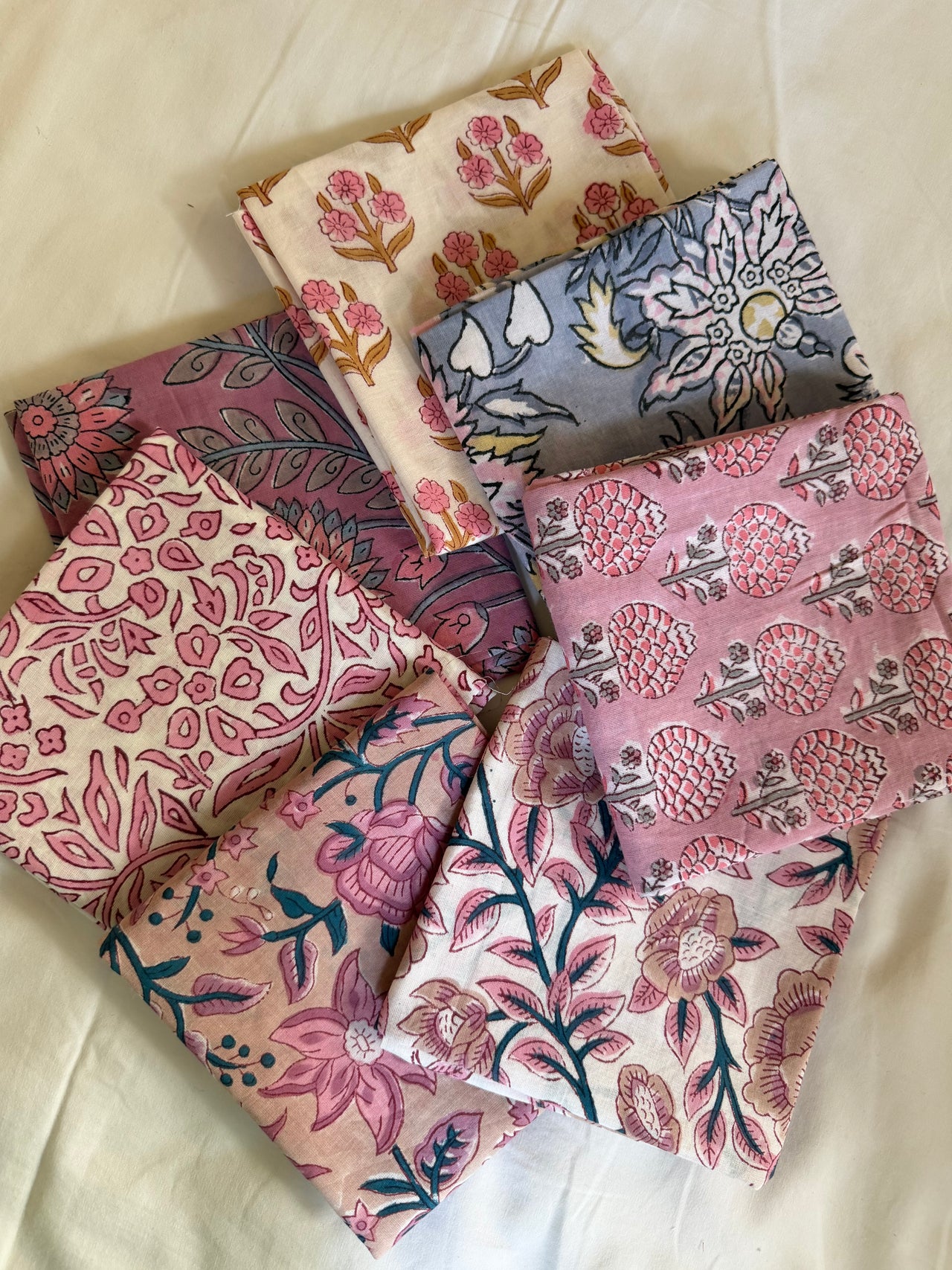 Collection of patterned fabric swatches on a light background