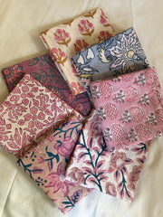 Collection of patterned fabric swatches on a light background