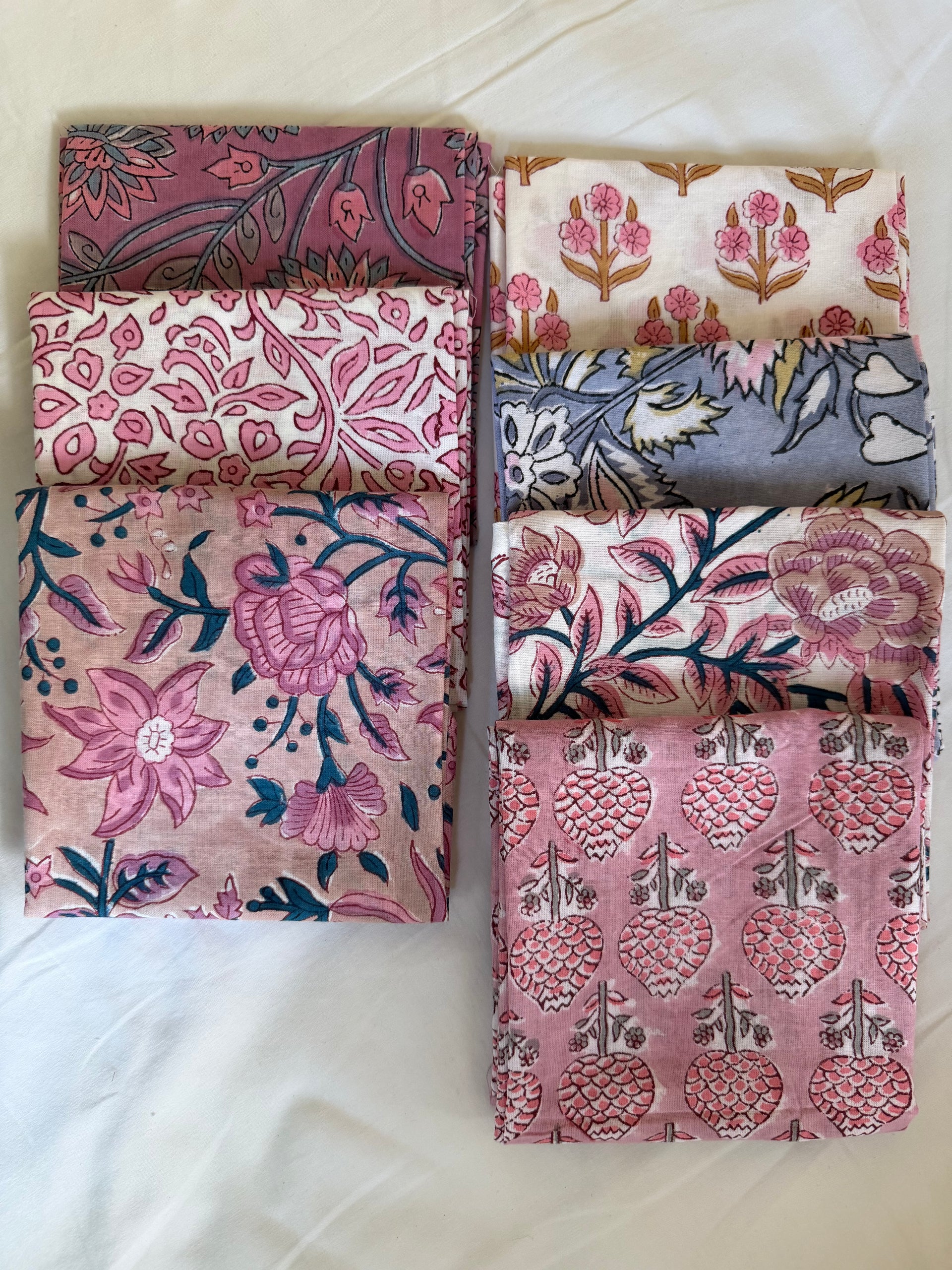 Set of floral patterned fabric swatches on a white background