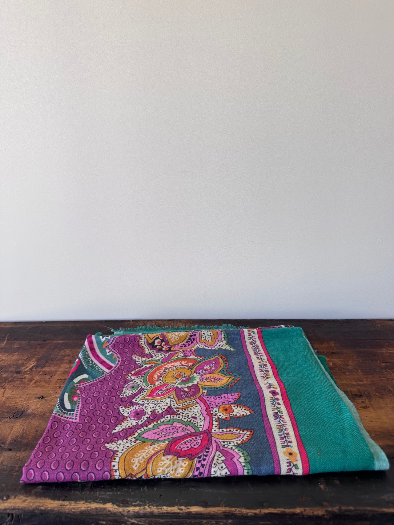Colorful patterned fabric on a wooden surface