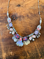 Necklace with colorful charms on a wooden surface