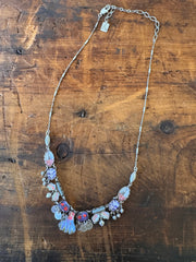 Necklace with floral design on a wooden surface