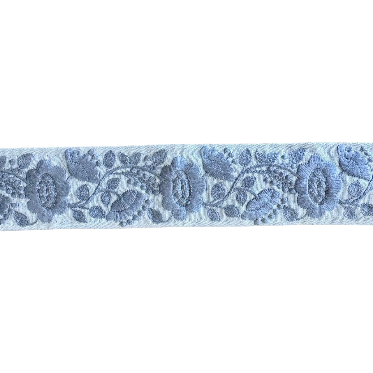 Floral lace ribbon with blue flowers on a white background