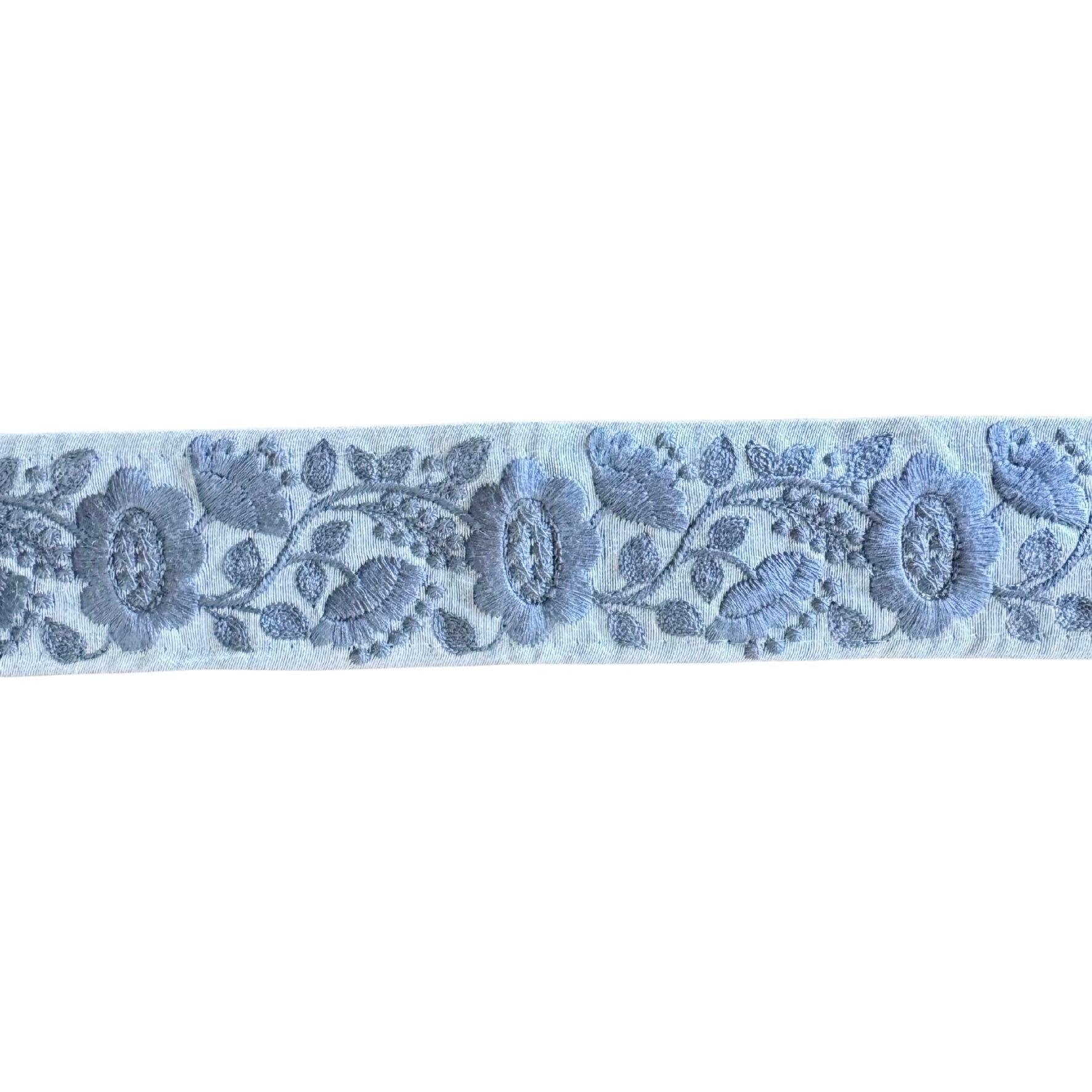 Floral lace ribbon with blue flowers on a white background