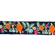 Embroidered floral pattern on a black background