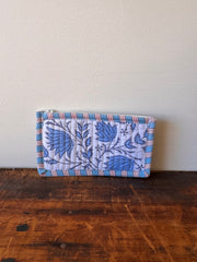 Floral-patterned fabric roll on a wooden surface