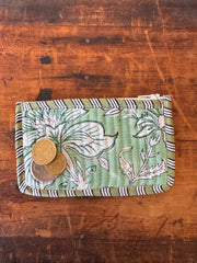 Floral-patterned wallet on a wooden surface