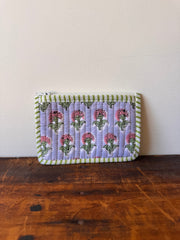 Folded fabric with floral pattern on a wooden surface
