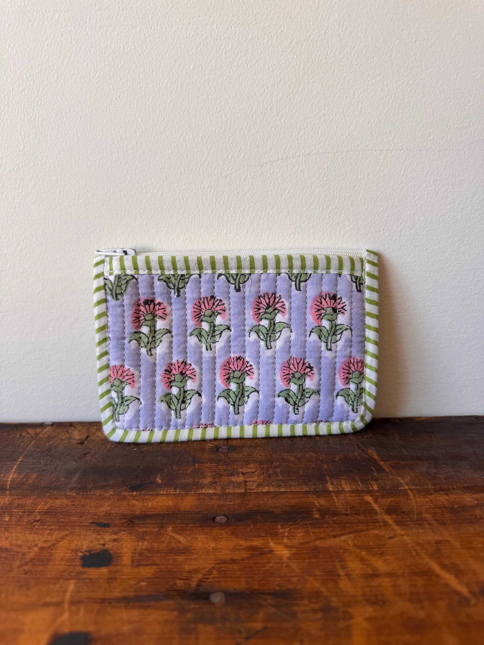 Folded fabric with floral pattern on a wooden surface