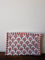 Floral patterned fabric roll on a white surface