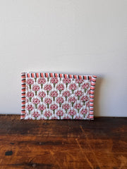 Notebook with floral pattern on a wooden surface
