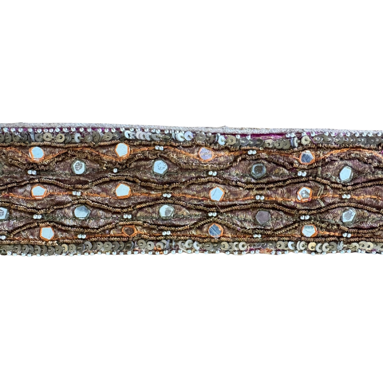 Decorative ribbon with intricate patterns and beads on a white background