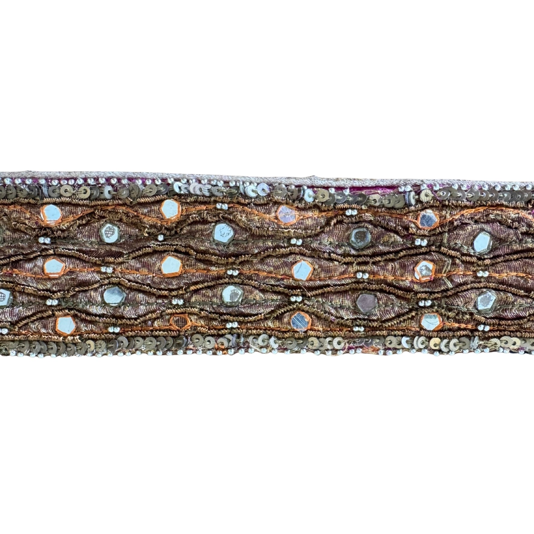 Decorative ribbon with intricate patterns and beads on a white background