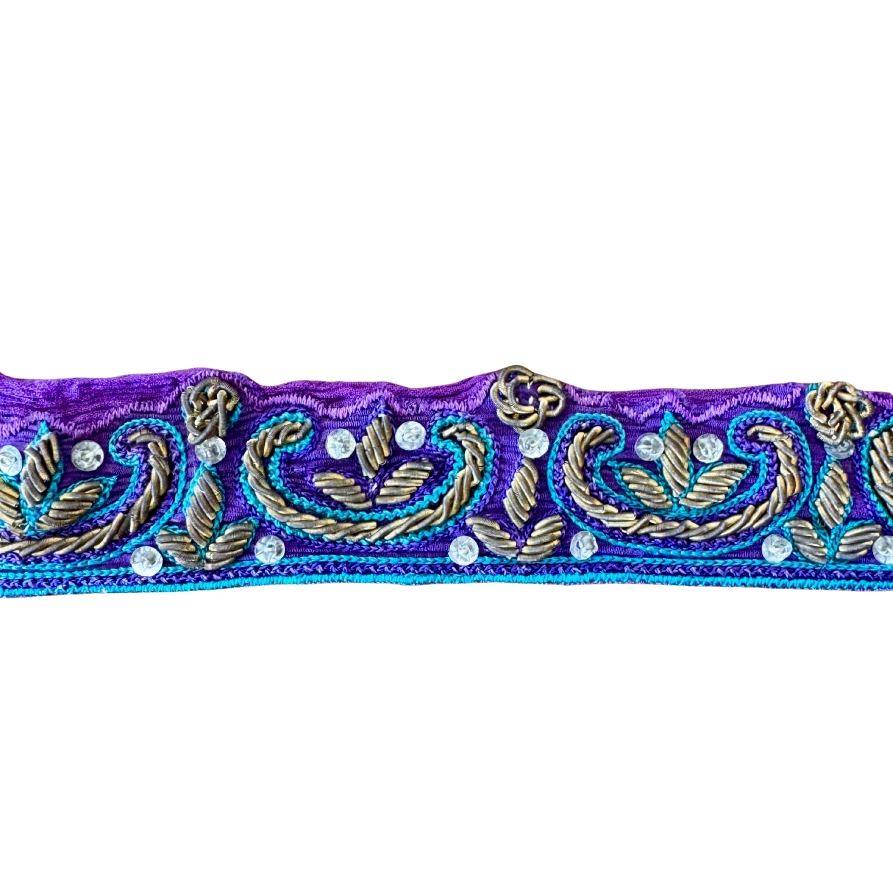Decorative band with intricate gold and blue patterns on a purple background
