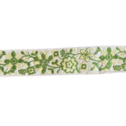 Floral embroidery ribbon with green and yellow flowers on a white background