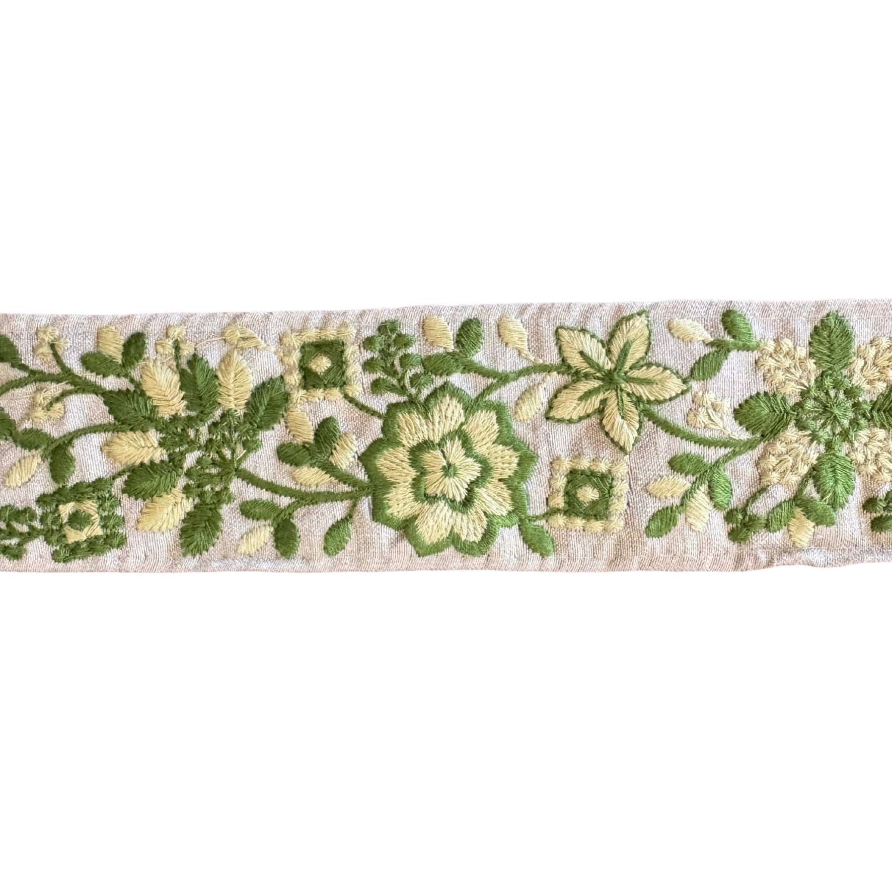 Embroidered floral ribbon with green and beige flowers on a white background