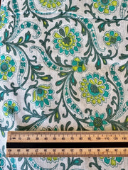 Floral patterned fabric with a ruler for scale on a white background