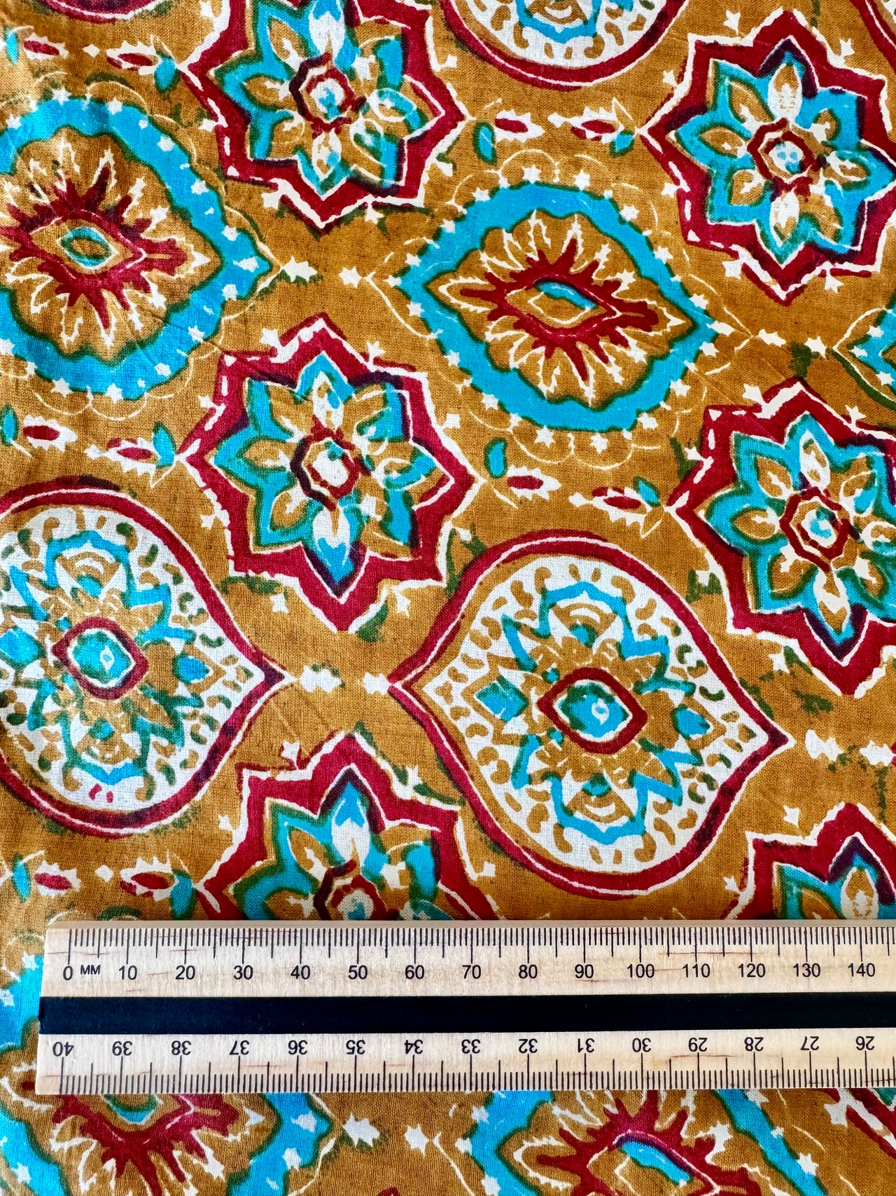 100% Cotton Fabric – Orange With Turquoise & Red Pattern
