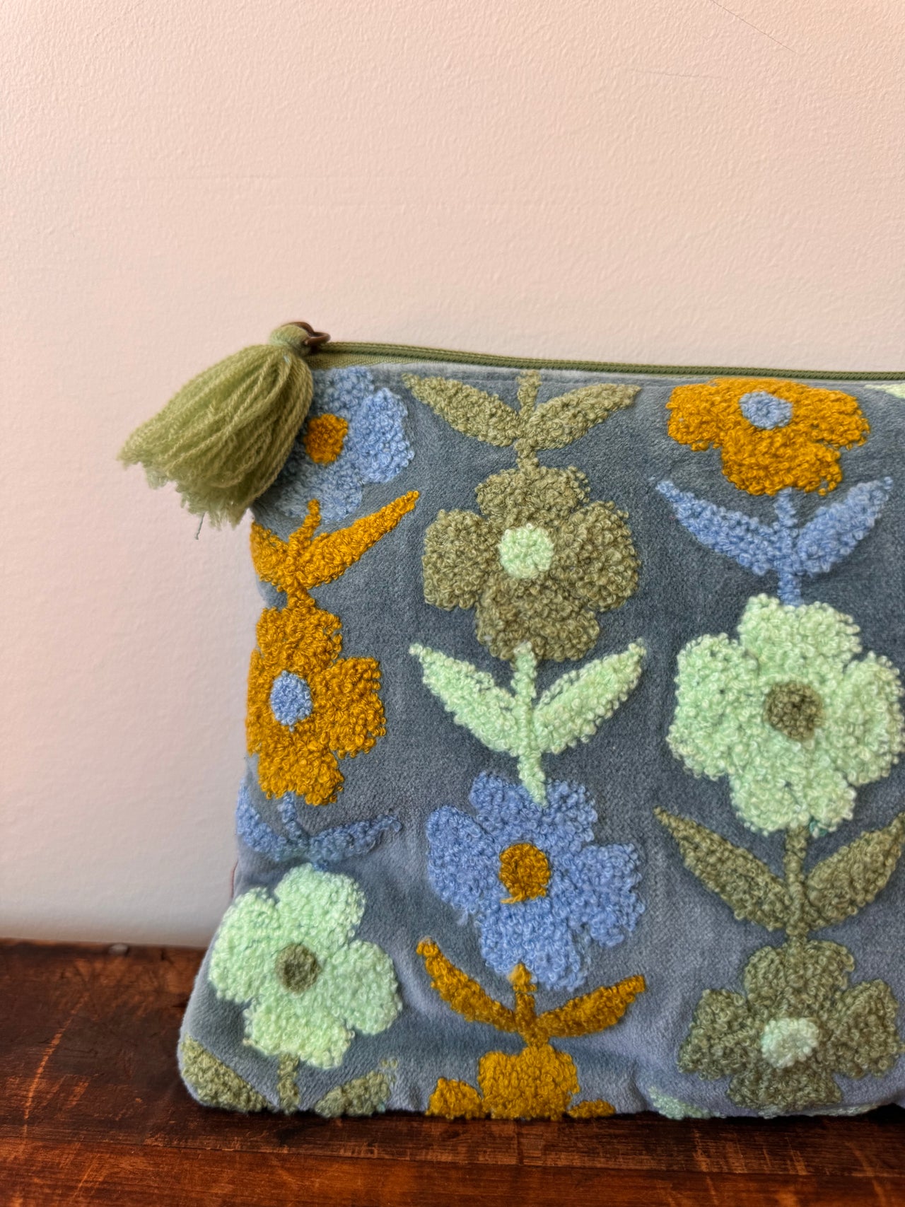 Decorative doormat with floral patterns on a plain background