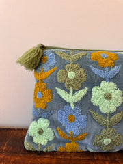 Decorative doormat with floral patterns on a plain background