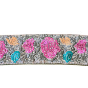 Decorative ribbon with floral patterns and sequins on a white background