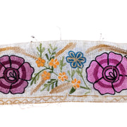 Embroidered fabric strip with flowers on a white background