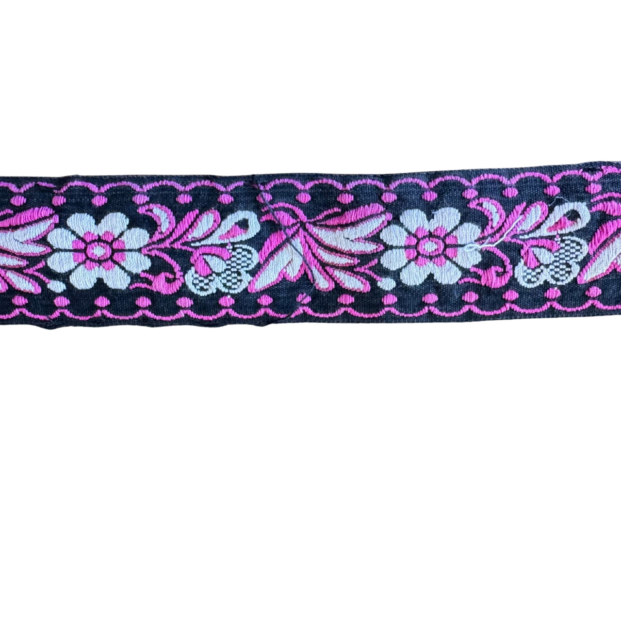 Decorative ribbon with floral and butterfly pattern on a white background