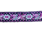 Decorative ribbon with floral and butterfly pattern on a white background