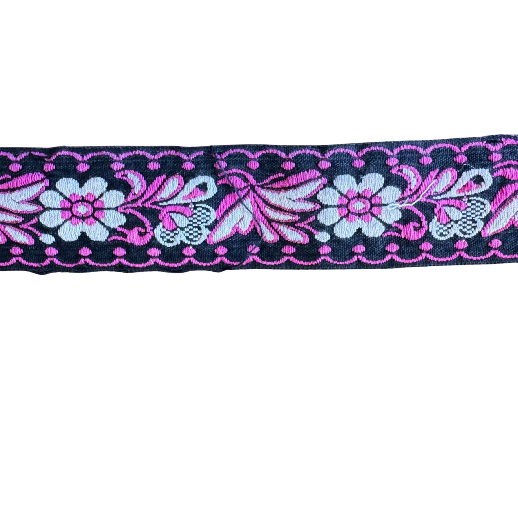 Decorative ribbon with floral and butterfly pattern on a white background