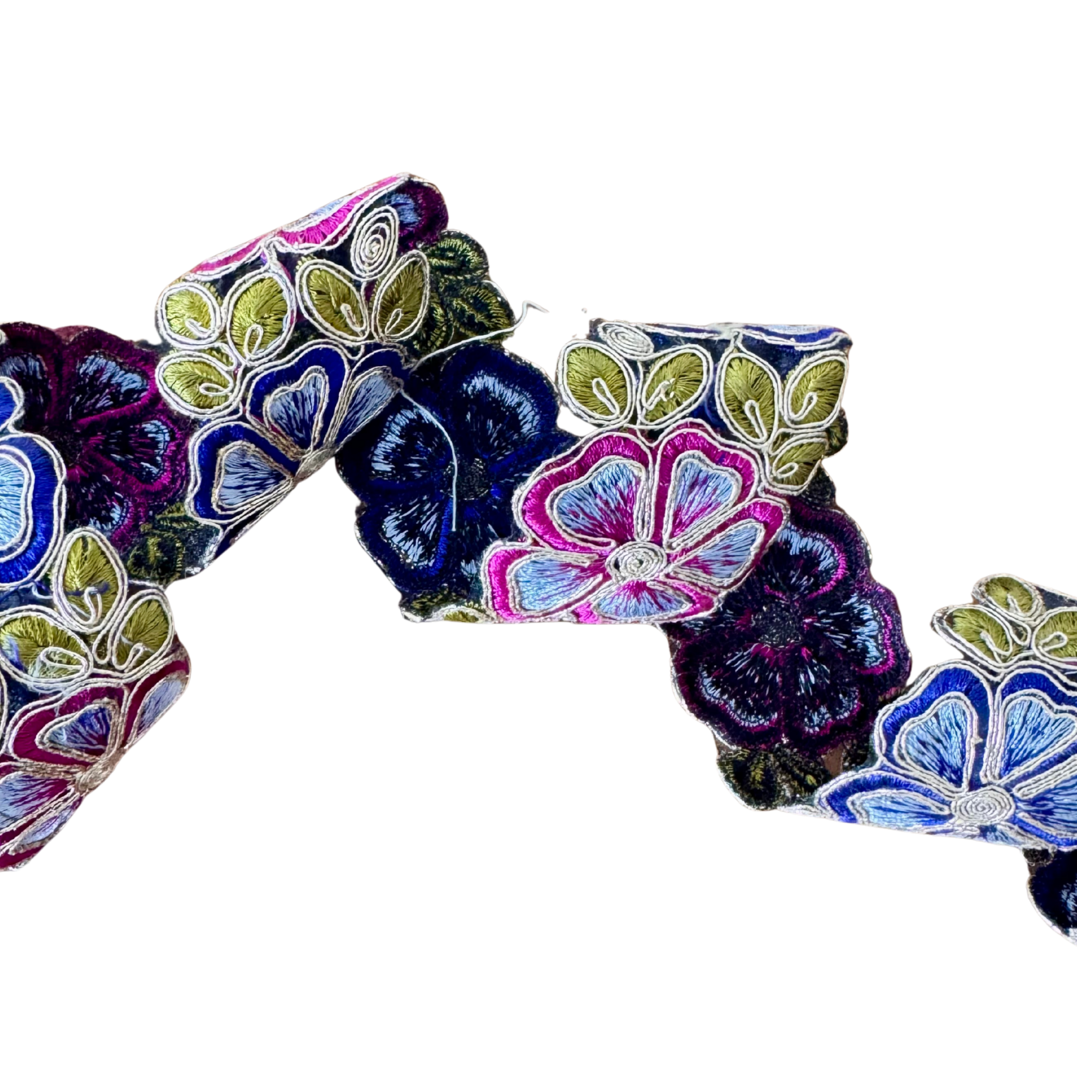 Colorful floral-patterned fabric roll on a white background 