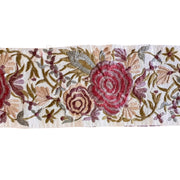 Floral patterned rug with red and pink flowers on a beige background