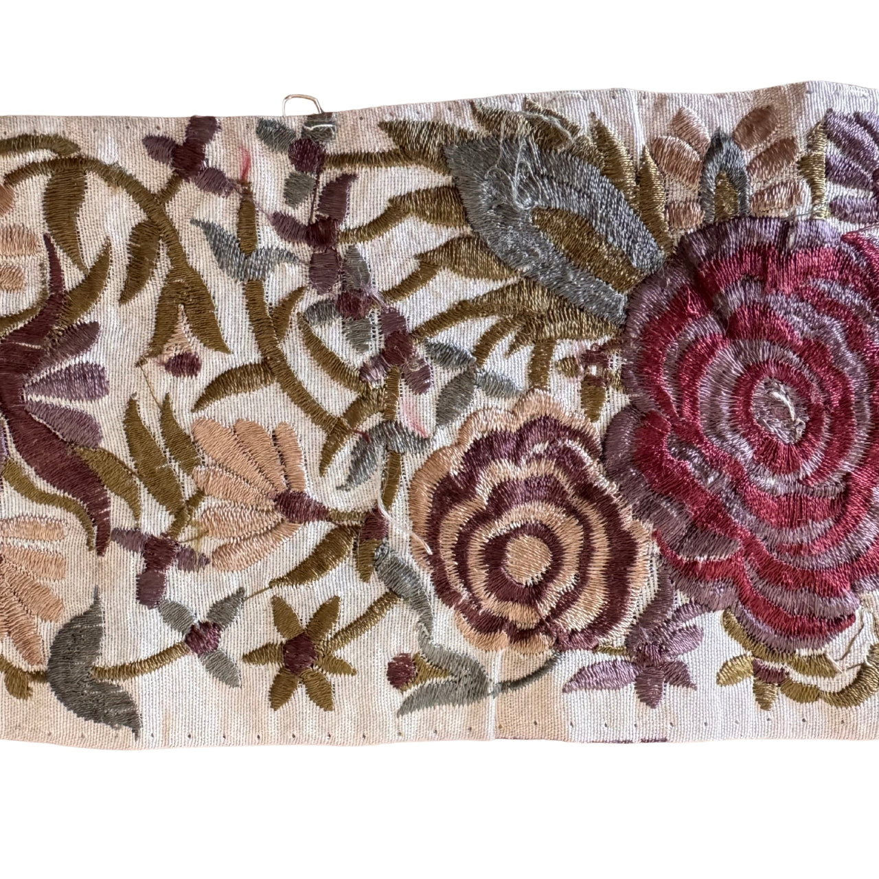 Embroidered fabric with floral patterns on a beige background