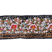 Decorative fabric trim with floral patterns on a black background